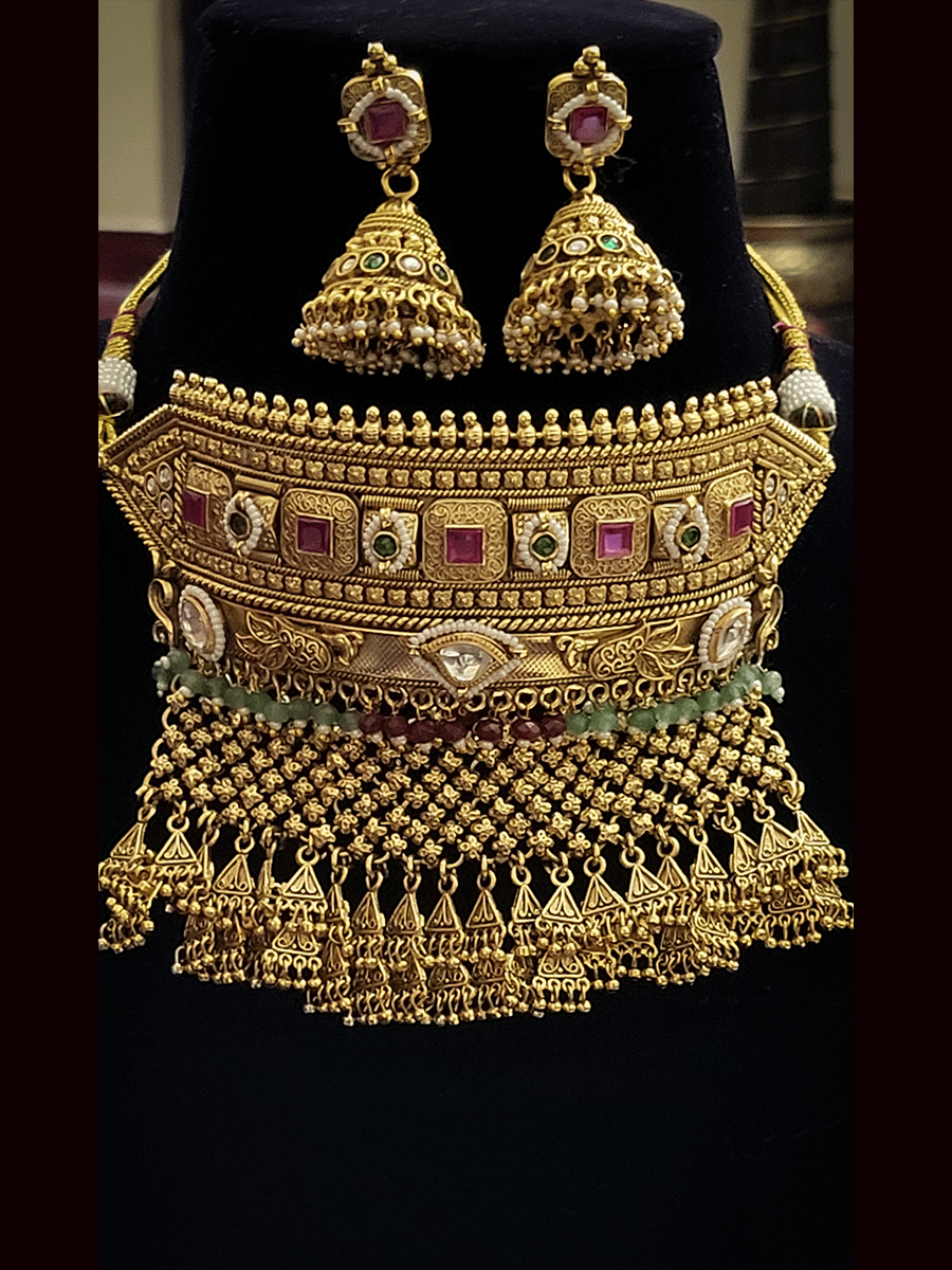 Ruby stone and kundan rajputi choker set with aqua and ruby beads detailing