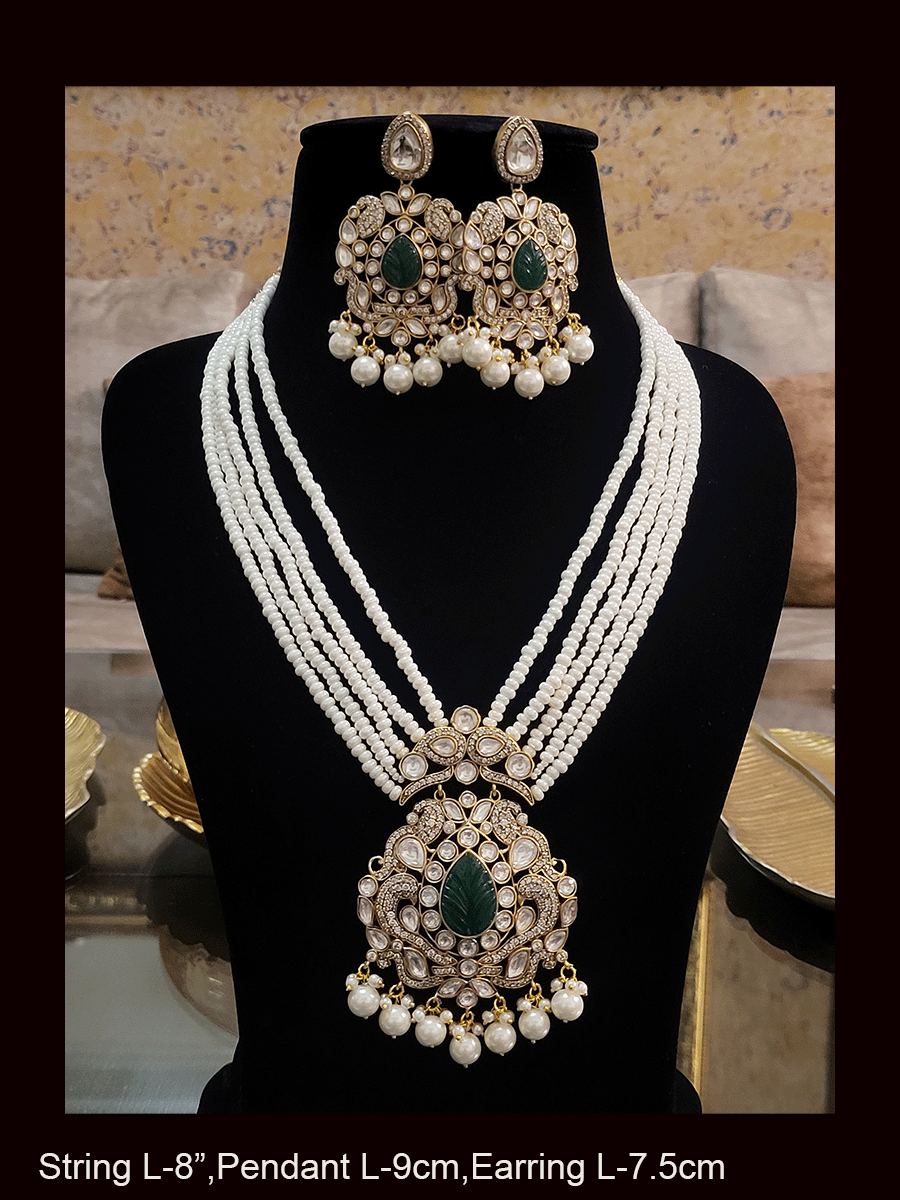 Five pearl strings kundan and AD studded set with tear drop shaped stone in the center