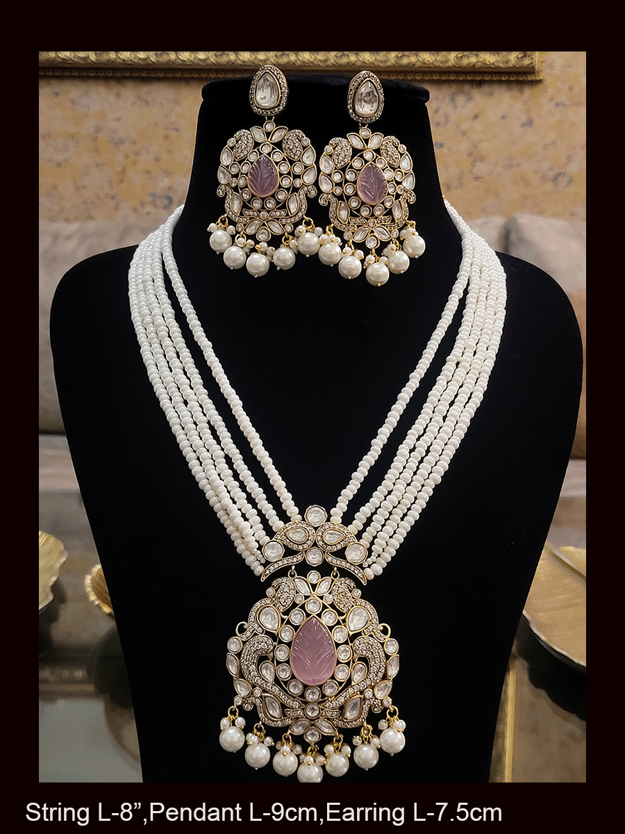 Five pearl strings kundan and AD studded set with tear drop shaped stone in the center