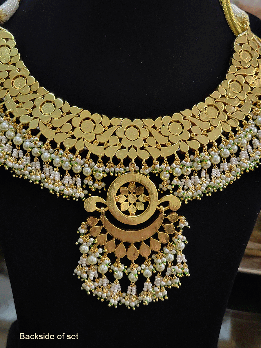 Ruby and yellow paachi kundan bridal set with circular center design with pearl bead hangings(base metal brass)