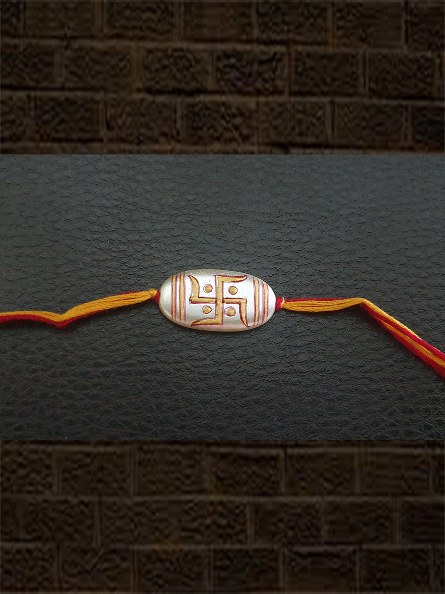 Hand painted swastik design white oval bead rakhi(approx.1inches bead) - Odara Jewellery