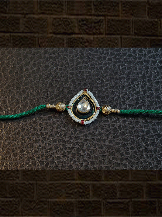 Green enamel leaf design rakhi with pirohi in green thread - Odara Jewellery