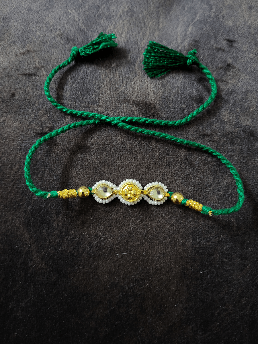 Two kundan leaf with pirohi work and antique tukdi rakhi in green thread - Odara Jewellery