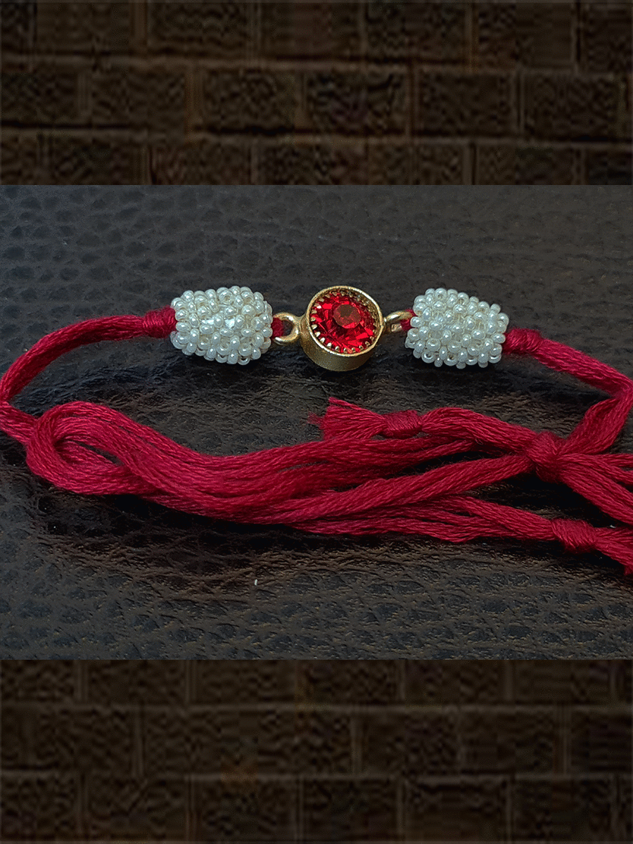 Red stone center with side pearl beads red thread rakhi - Odara Jewellery